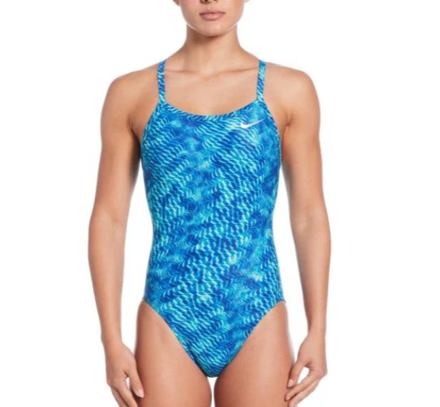 Woman wearing blue patterned one-piece swimsuit