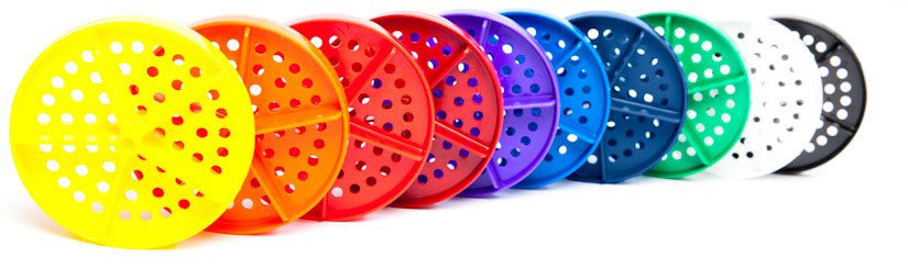Row of colorful perforated plastic discs