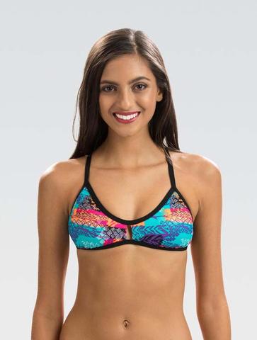 Smiling woman wearing colorful patterned bikini top