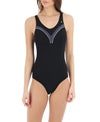 Woman wearing black one-piece swimsuit with chevron