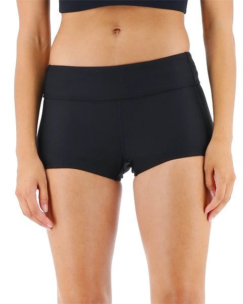 Woman wearing black athletic shorts