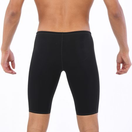 Back view of man wearing black compression shorts