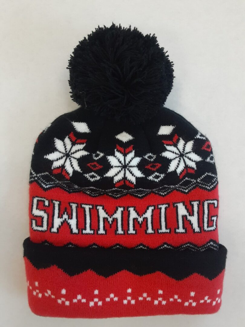 Red pom-pom beanie with "SWIMMING" text