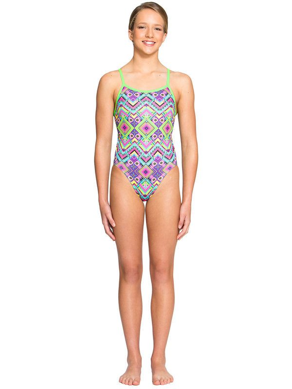 Person wearing colorful geometric one-piece swimsuit