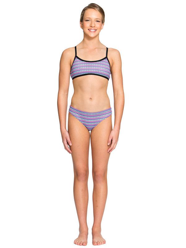 person in patterned two-piece swimsuit standing