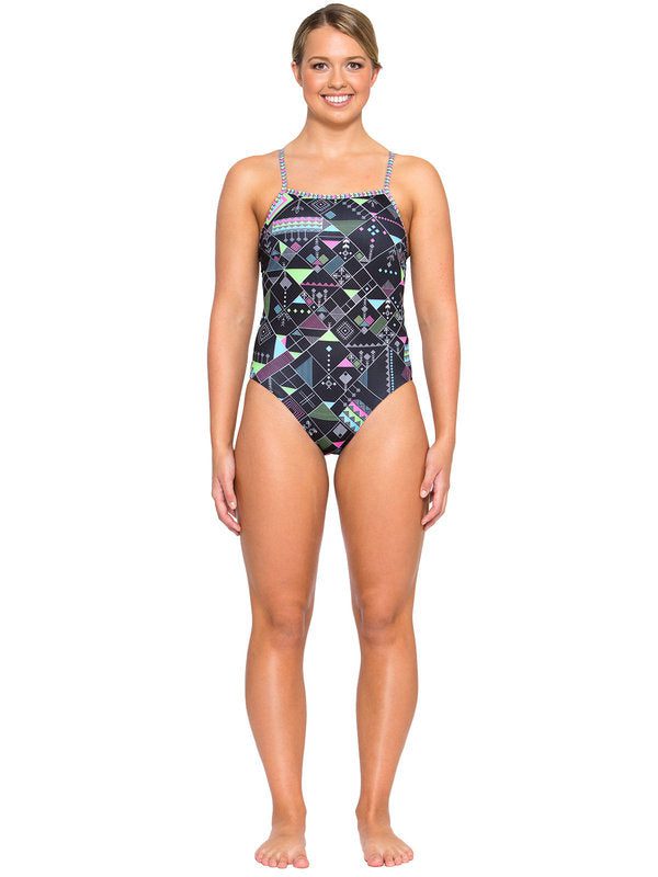 Smiling woman wearing geometric print one-piece swimsuit