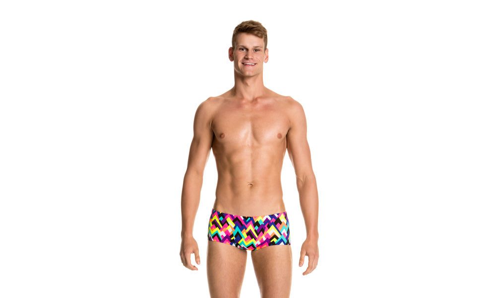 Shirtless man wearing colorful swim trunks