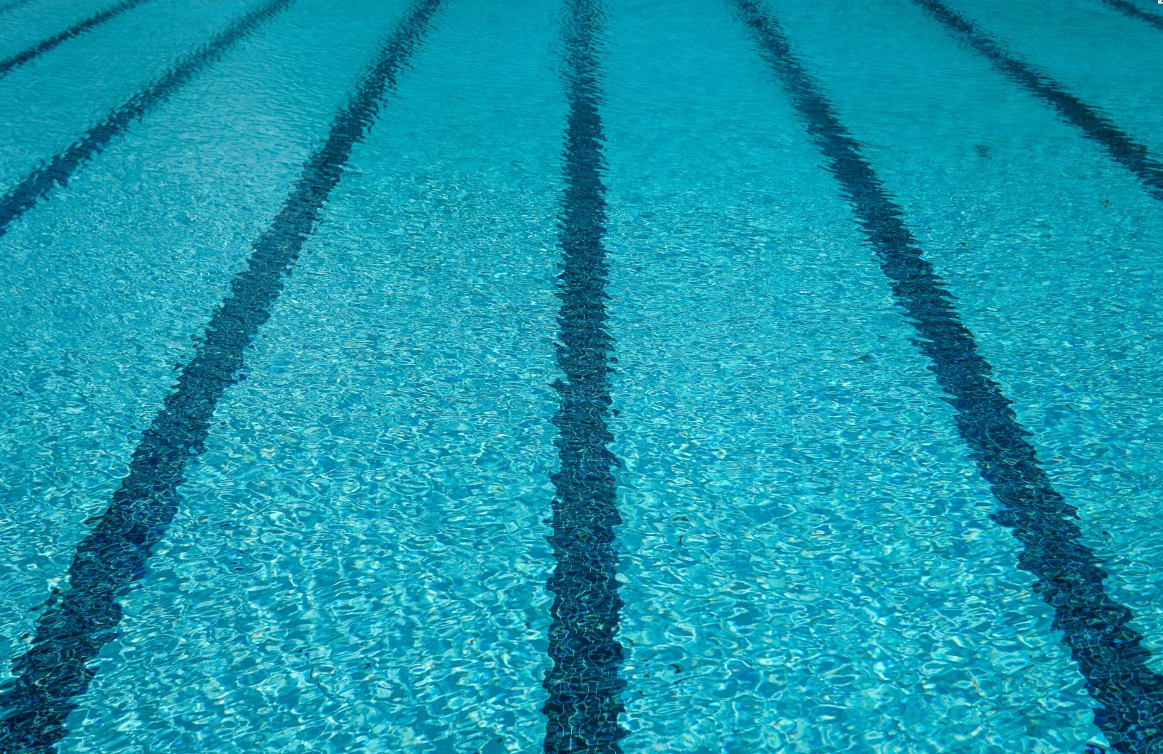 Clear blue swimming pool lanes from above